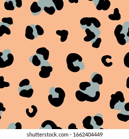 Simple trend pattern. Orange background, green black leopard spots. The print is well suited for textiles, Wallpaper, and packaging.