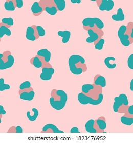 Simple trend pattern. Pink and blue leopard spots. Pale pink background. Vector texture. Fashionable print for Wallpaper.