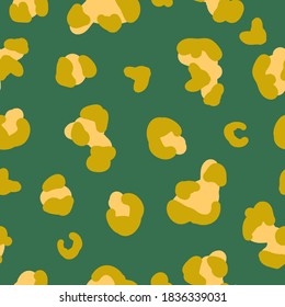 Simple trend pattern. Yellow mustard leopard spots. Green background. Vector texture. Elegant fashion print for Wallpaper.