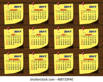 Simple vector calendar 2017 year.  Yellow sheet for notes on the background of the wooden boards. Week starts with Sunday.  Vector image.