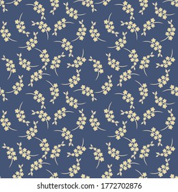 Simple vector floral seamless pattern. Abstract ornament with simple small flowers on branches. Liberty style print. Ditsy background texture. Dark blue, yellow and beige color. Stylish repeat design 