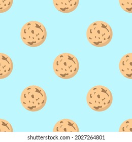 Simple vector seamless pattern. Small gingerbread cookies on a light blue background. Traditional sweet pastries.