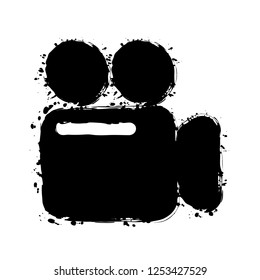Simple video camera icon. Black ink with splashes on white background