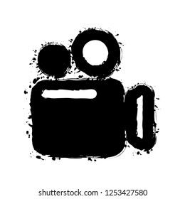 Simple video camera icon. Black ink with splashes on white background
