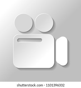 Simple video camera icon. Paper style with shadow on gray background