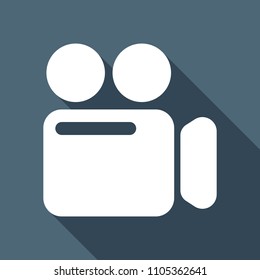 Simple video camera icon. White flat icon with long shadow on background