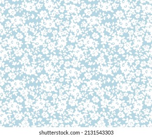 Sencillo patrón floral vintage. Pequeñas flores blancas de fondo azul. Simple y lindo patrón en pequeñas flores blancas con fondo gris. Estilo de la libertad. Impresión Ditsy.