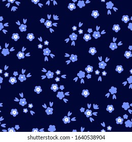 Simple vintage pattern. Black background, blue flowers, leaves. The print is well suited for textiles, Wallpaper, and packaging.