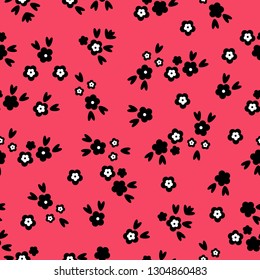 Simple vintage pattern. Coral background, small black flowers. Good print for textiles, packaging.