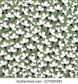 Patrón vintage simple. Flores blancas ricas, hojas negras. Fondo verde. Impresión de moda para textiles y papel pintado.