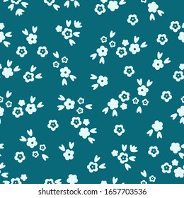 Simple vintage pattern. Dark blue background, small white flowers, ornament. The print is well suited for textiles and Wallpaper.