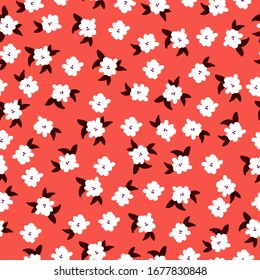 Sencillo patrón vintage. Fondo naranja, flores blancas pequeñas, hojas oscuras. La impresión está bien adaptada para textiles, papel pintado y embalaje.