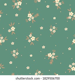 Simple vintage pattern. Small beige flowers. Green background. Spring bouquet. Vector texture. Elegant fashion print for Wallpaper .