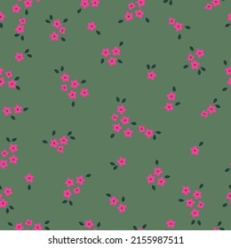 Simple vintage pattern. Small pink flowers, golden leaves. Green background. Fashionable print for textiles, wallpaper and packaging.