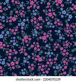 Simple vintage pattern. small pink and blue flowers. green leaves. dark blue background. Fashionable print for textiles and wallpaper.