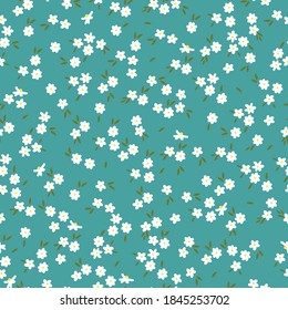 Simple vintage pattern. Small white flowers . Turquoise background. Vector texture. Fashionable elegant print for Wallpaper.