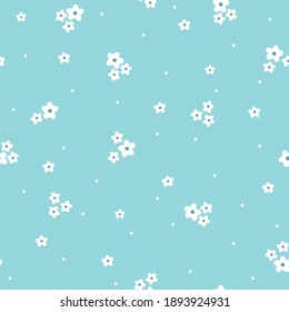 Simple vintage pattern. Small white flowers. soft blue background. Fashionable print for wallpaper and textiles. Vector texture.