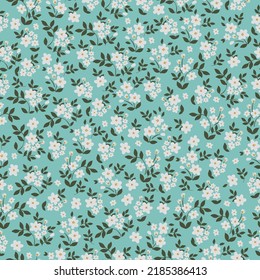 Simple vintage pattern. Small white flowers, green leaves. blue background. Fashionable print for textiles and wallpaper.