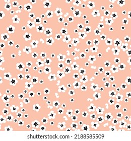 Simple vintage pattern. small white flowers. light coral background. Fashionable print for textiles and wallpaper.