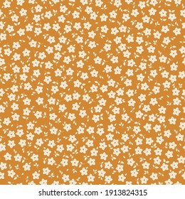 simple vintage pattern . terracotta background. small white flowers. vector texture. trend print for wallpaper and textiles.