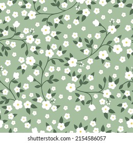 Patrón vintage simple. flores blancas, hojas verdes. Fondo verde claro. Impresión de moda para textiles, papel pintado y embalaje.
