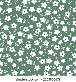 Simple vintage pattern. white flowers and leaves . green background. Fashionable print for textiles, wallpaper and packaging.