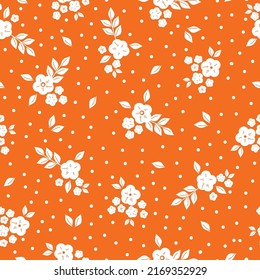 Simple vintage pattern. White flowers and leaves. Orange background. Fashionable print for textiles and wallpaper.