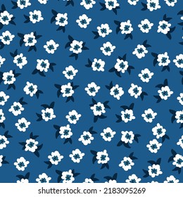 Simple vintage pattern. white flowers, dark blue leaves. blue background. Fashionable print for textiles and wallpaper.