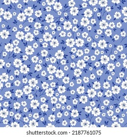 Simple vintage pattern. white flowers, dark blue leaves. light blue background. Fashionable print for textiles and wallpaper.