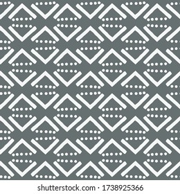 A simple white and gray pattern of triangles and dots. Hand illustration. Scandinavian style, design for wallpaper, fabric, textile.