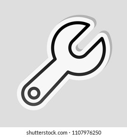 Simple wrench. Linear, thin outline. Sticker style with white border and simple shadow on gray background
