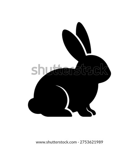 A simple yet elegant black silhouette of a rabbit, depicted in a sitting or resting posture. The rabbit faces to the right, showcasing its characteristic long ears, a rounded body, and a small, distinct tail. The design is clean and minimalistic, making it versatile for various uses, especially for spring and Easter-themed designs.