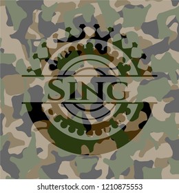 Sing written on a camouflage texture