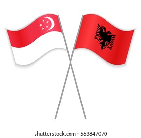 Singaporean and Albanian crossed flags. Singapore combined with Albania isolated on white. Language learning, international business or travel concept.