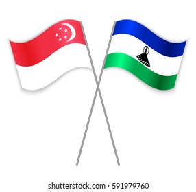 Singaporean and Basotho crossed flags. Singapore combined with Lesotho isolated on white. Language learning, international business or travel concept.