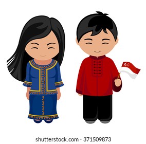 Singaporeans in national dress with a flag. A man and a woman in traditional costume.