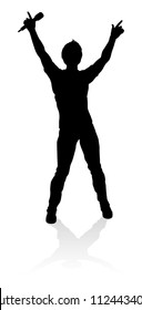 A singer pop, country music, rock star or hiphop rapper artist vocalist singing in silhouette
