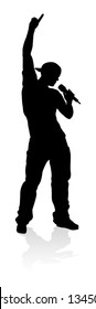 A singer pop, country music, rock star or hiphop rapper artist vocalist singing in silhouette