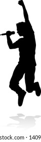 A singer pop, country music, rock star or hiphop rapper artist vocalist singing in silhouette