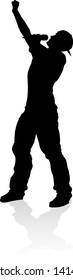 A singer pop, country music, rock star or hiphop rapper artist vocalist singing in silhouette