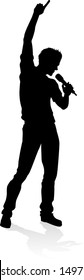 A singer pop, country music, rock star or hiphop rapper artist vocalist singing in silhouette