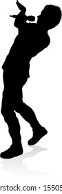 A singer pop, country music, rock star or hiphop rapper artist vocalist singing in silhouette