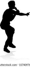 A singer pop, country music, rock star or hiphop rapper artist vocalist singing in silhouette