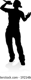 A singer pop, country music, rock star or hiphop rapper artist vocalist singing in silhouette