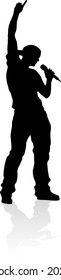 A singer pop, country music, rock star or hiphop rapper artist vocalist singing in silhouette