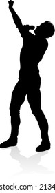 A singer pop, country music, rock star or hiphop rapper artist vocalist singing in silhouette