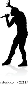 A singer pop, country music, rock star or hiphop rapper artist vocalist singing in silhouette