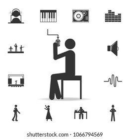 Singer sitting with microphone icon. Detailed set of music icons. Premium quality graphic design. One of the collection icons for websites web design mobile app on white background