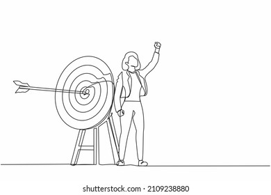 Single continuous line drawing active businesswoman fist pump her arrow directed into target. Target goal, focus and progress. Business archery, arrow hit focus. One line draw graphic design vector