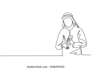 Single continuous line drawing an Arab male pours hand sanitizer into his palms to avoid germs and be more hygienic. Protection against corona virus. One line draw graphic design vector illustration.